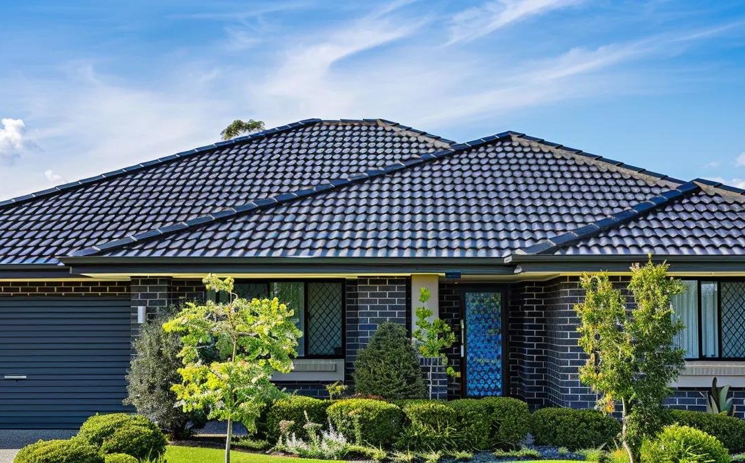 Diverse roofing materials including metal, tiles, and eco-friendly options displayed in front of a Brisbane home